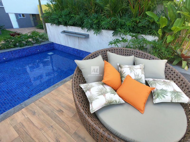 area de lazer com sofas no deck da piscina breeze residence